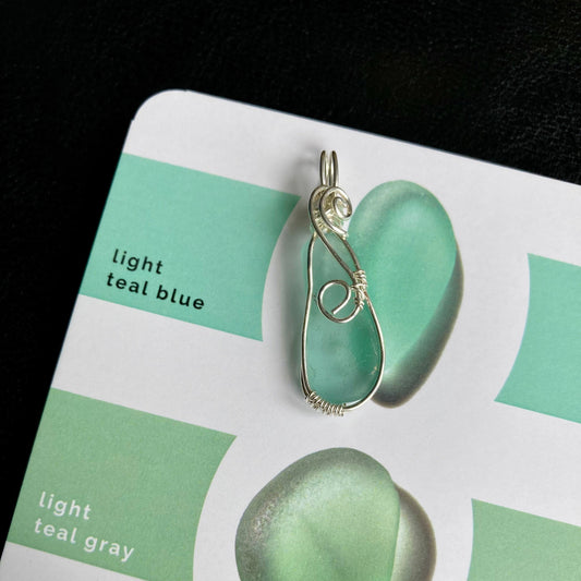 Light teal blue sea glass silver plated necklace